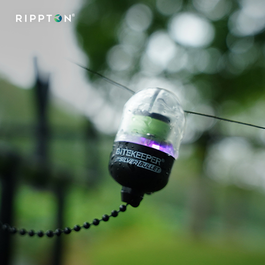 Compact fishing bite indicator bobbin with sleek design for anglers.