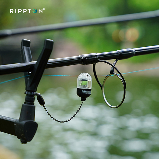 Illuminated fishing bobbin attached to a rod's line, perfect bite alarm bobbins in carp fishing