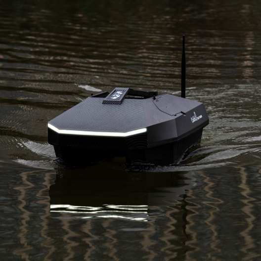 GPS bait boat with sleek design and LED strip, featuring rc capabilities for carp fishing and precise bait dropping on lake