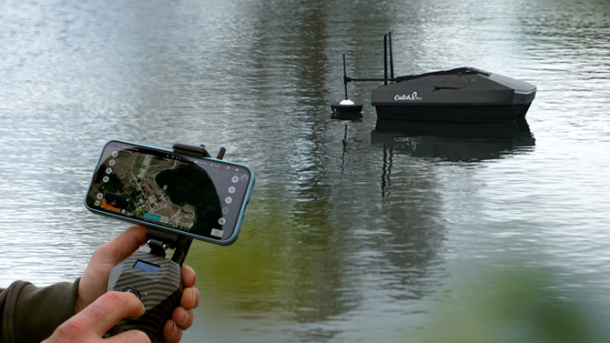 bait boat on water with wireless remote control and fish finder