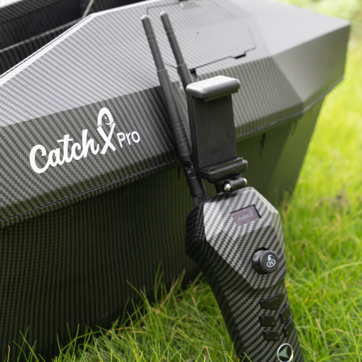 CatchX Pro carp bait boat with GPS and sonar system mounted on carbon fiber hull, featuring dual wireless antennas