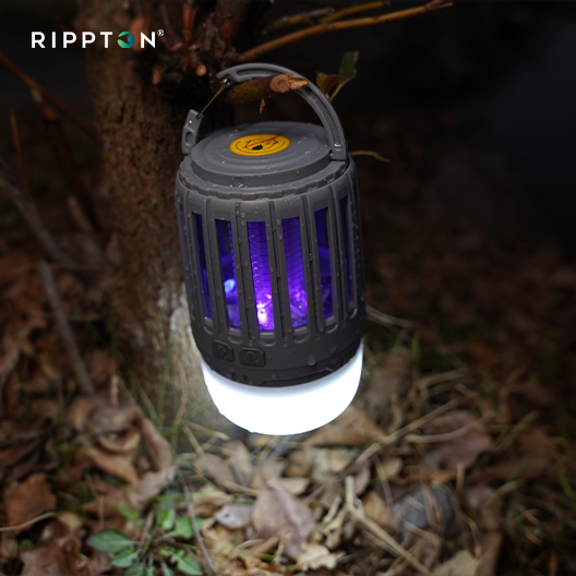 Rippton Mozzie R1 mosquito killer lamp battery operated hanging outside a tent. mosquito killer lamp outdoor
