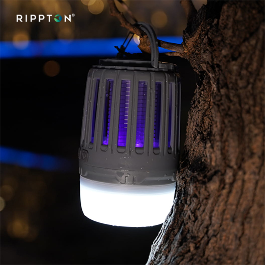 Spider Mozzie R1 mosquito insect killer lamp emitting and illuminating a holiday camping tent at night safe for pets and children